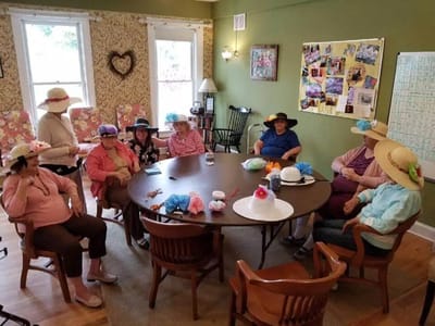 Residents participating in a craft activity in a common area