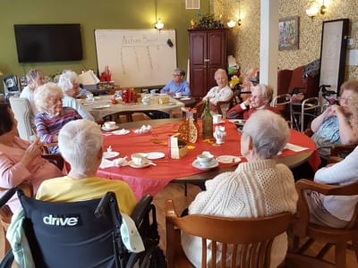 Residents socializing in a common area during a gathering