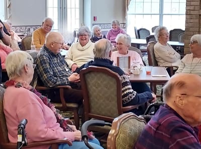 Residents enjoying a lively conversation in the common area
