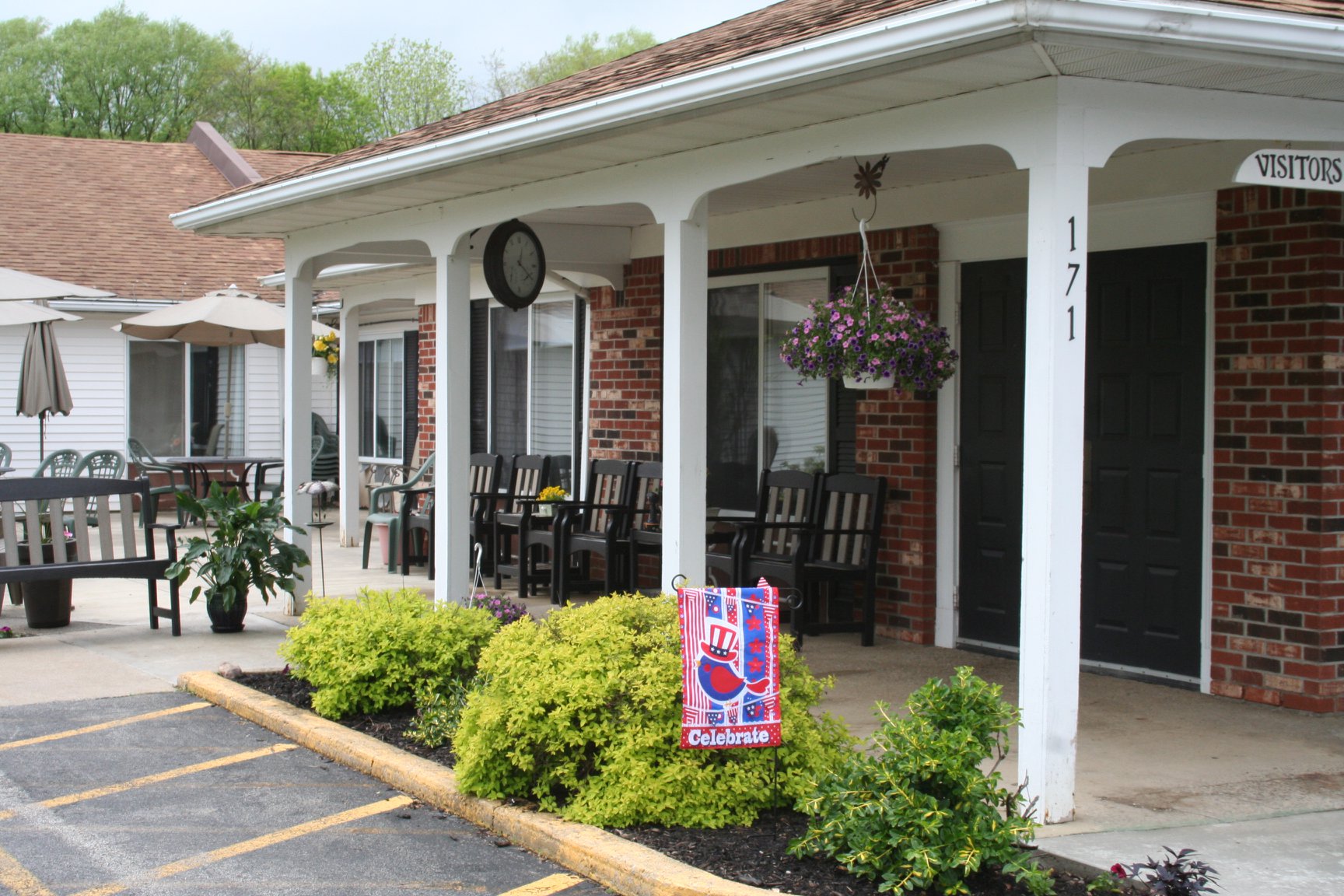 Entryway of a senior living facility with outdoor seating