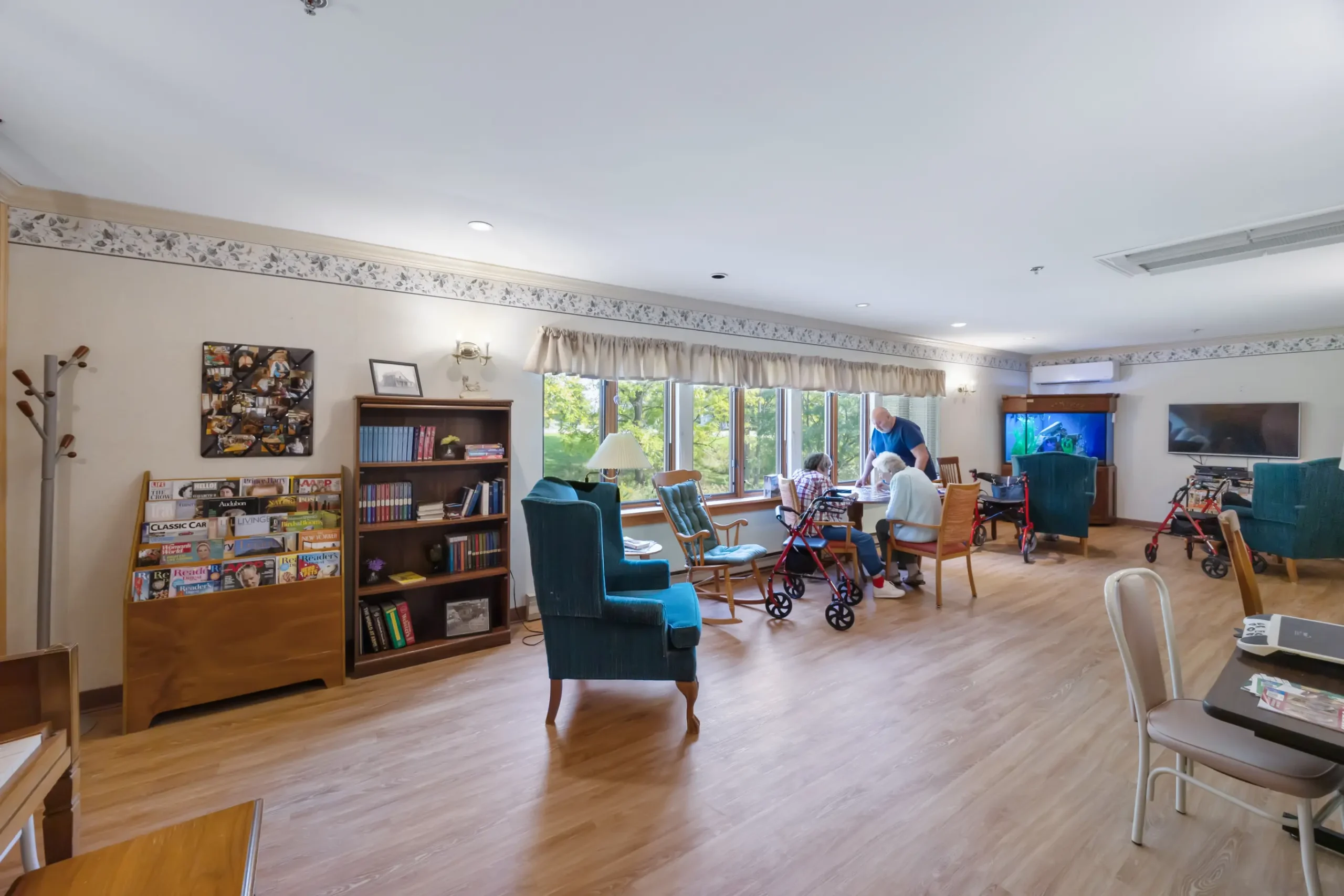 Residents engaged in activities in a bright common area