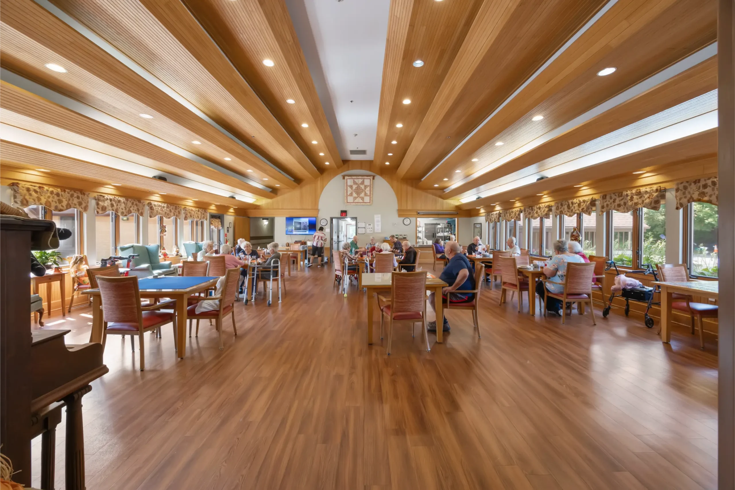 Interior view of a common area with residents engaged in various activities