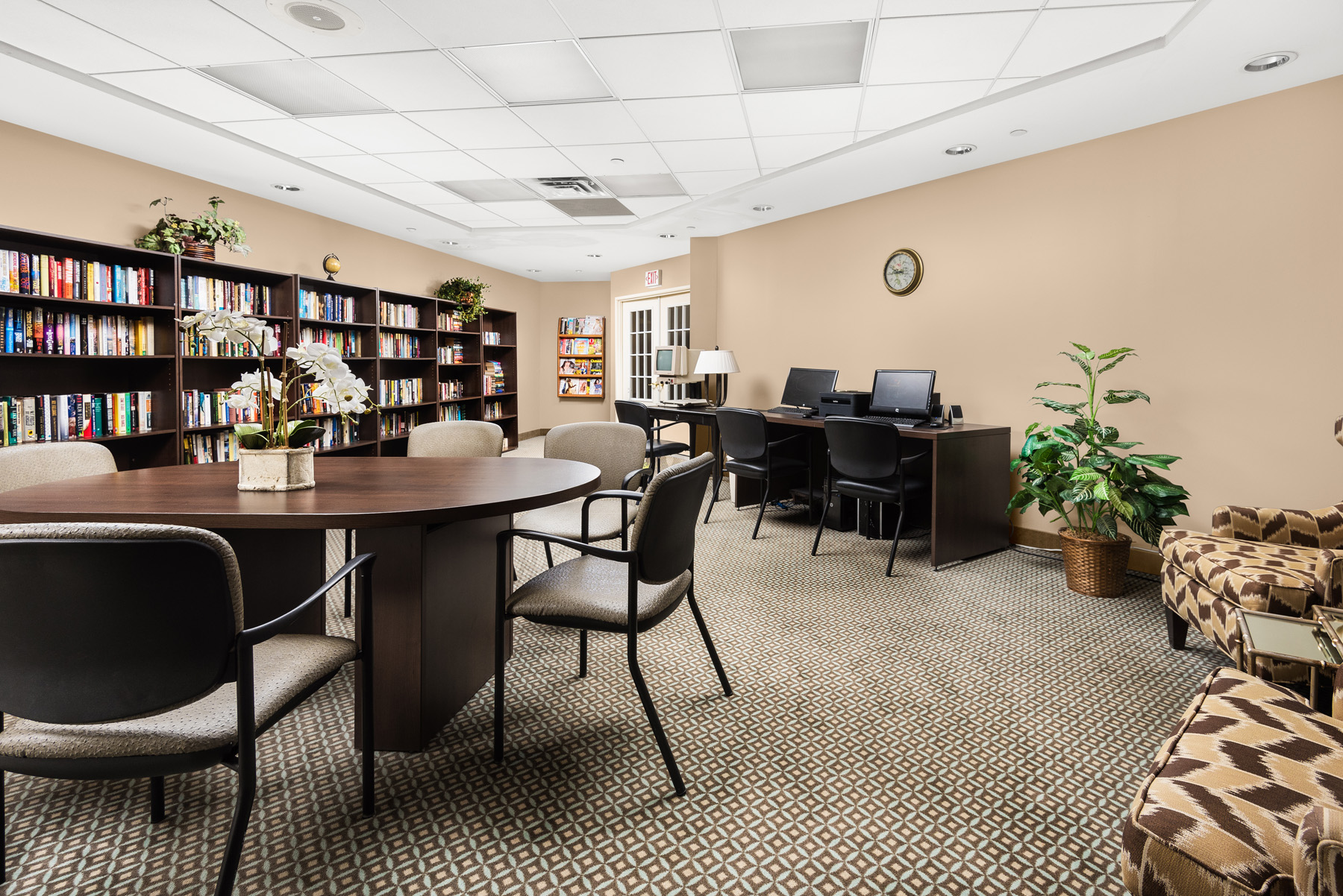 Interior view of a common area with bookshelves and seating