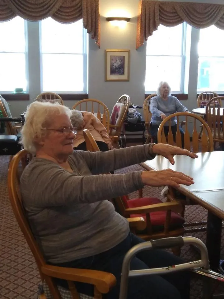 Residents participating in a seated activity