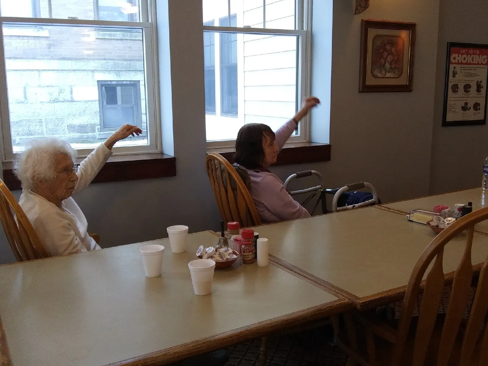 Two residents engaging in conversation in a common area