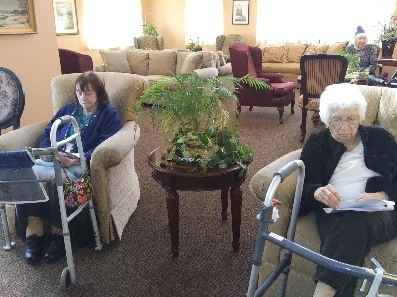 Residents engaging in quiet activities in a common area