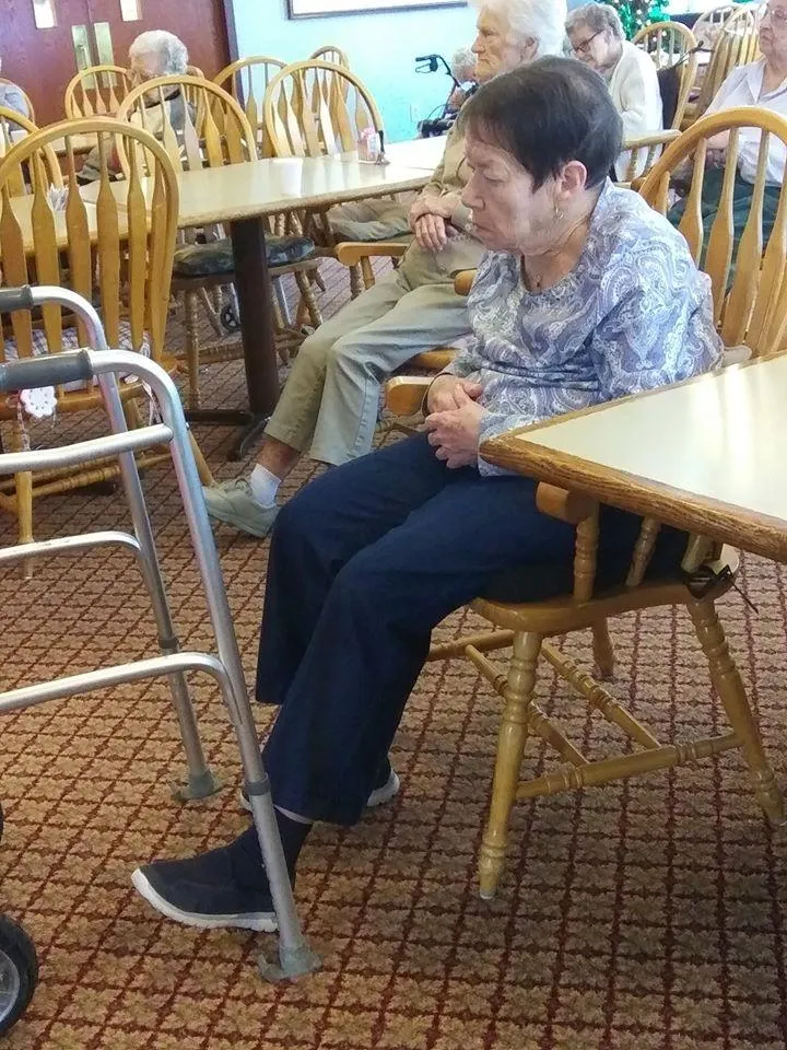 Residents seated in a common area of the facility