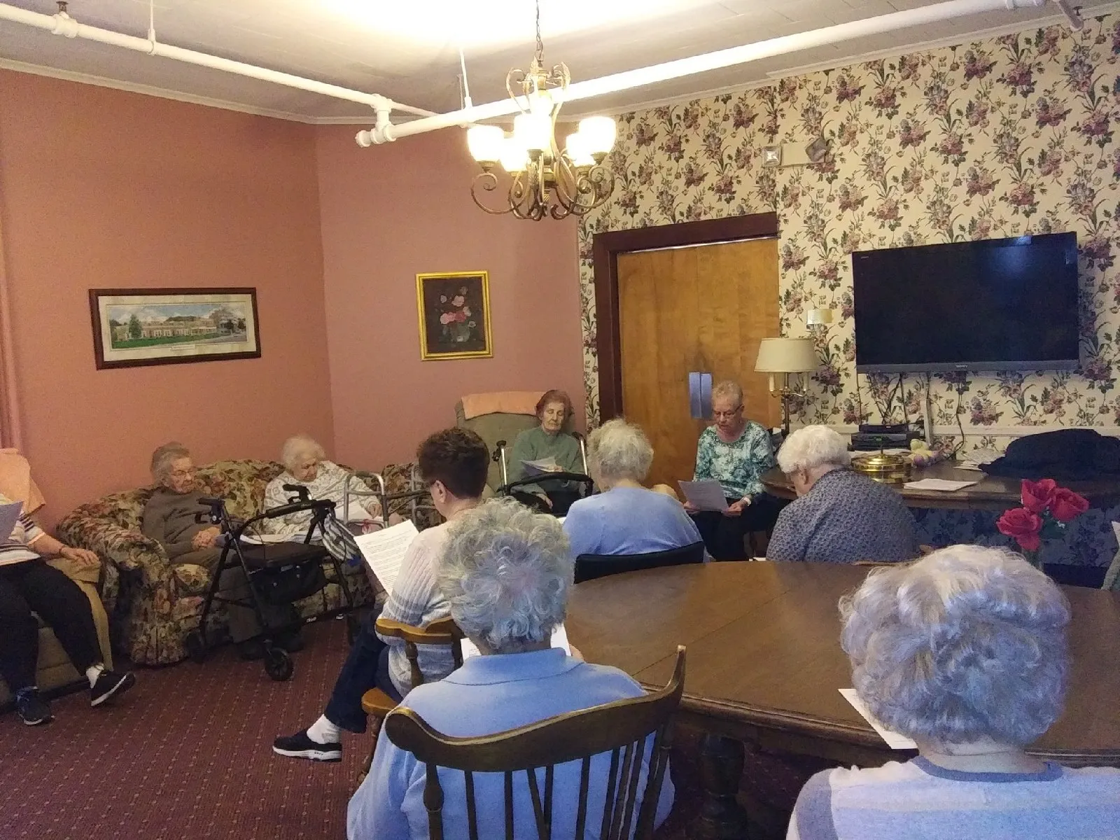 Residents participating in a group activity in a common area