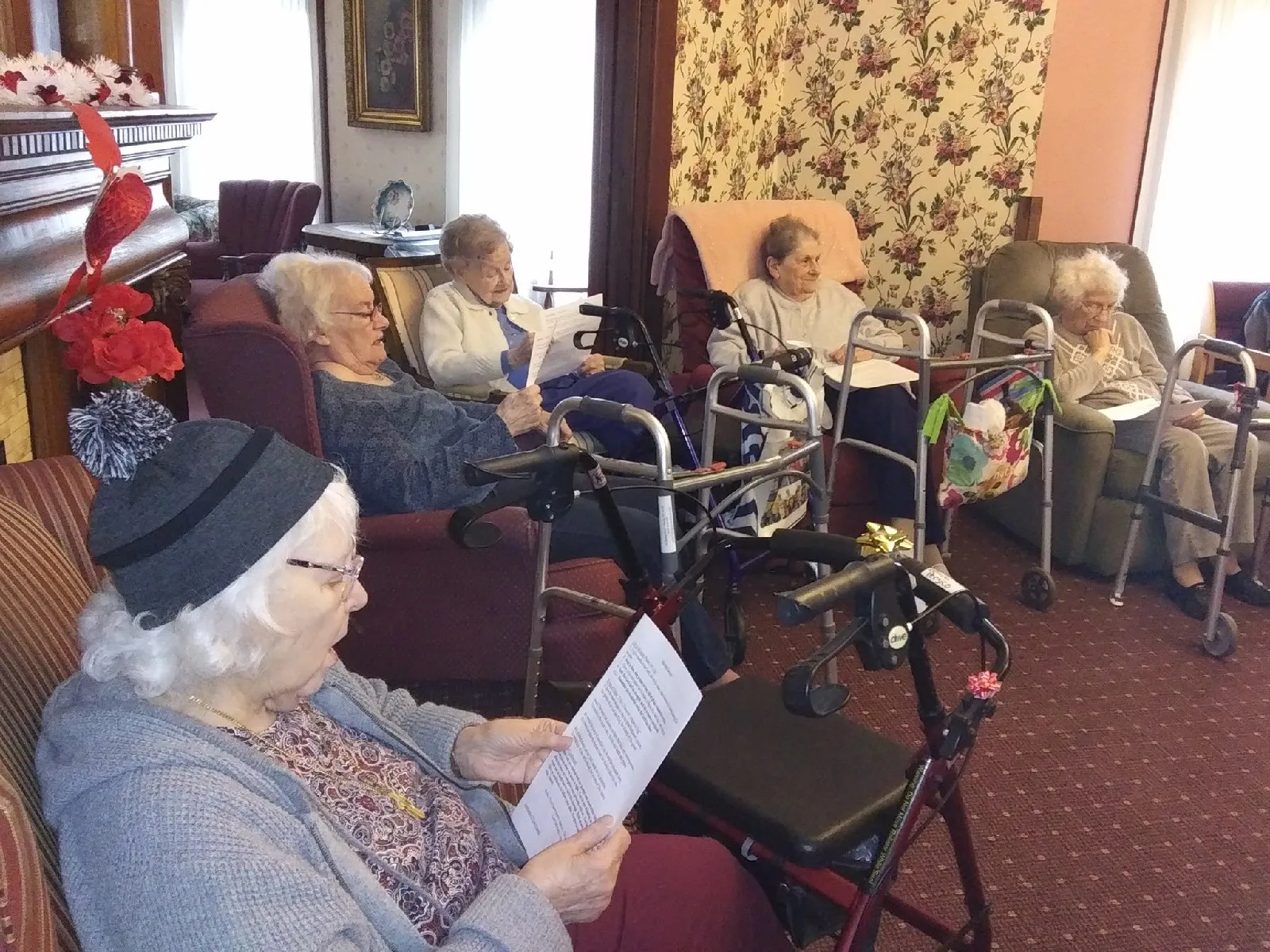 Residents engaged in an indoor activity in a cozy room