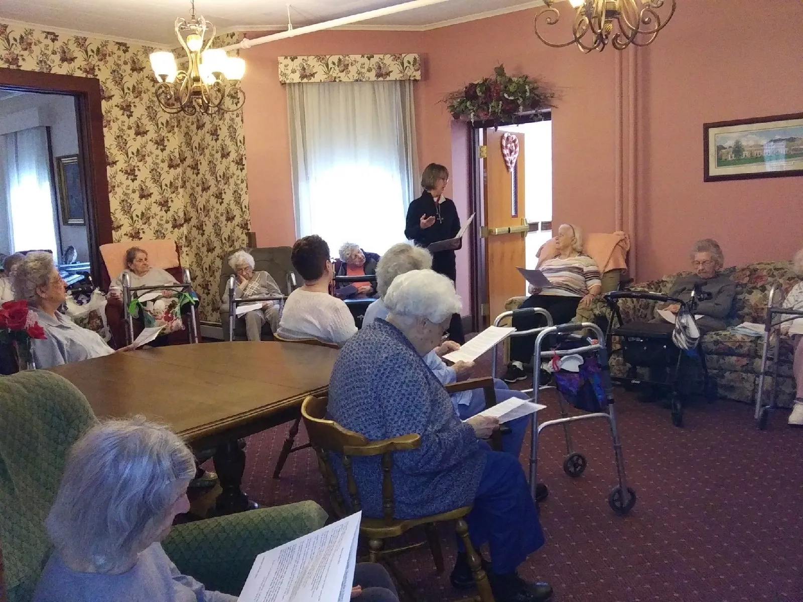 Residents participating in a group activity in the lounge.