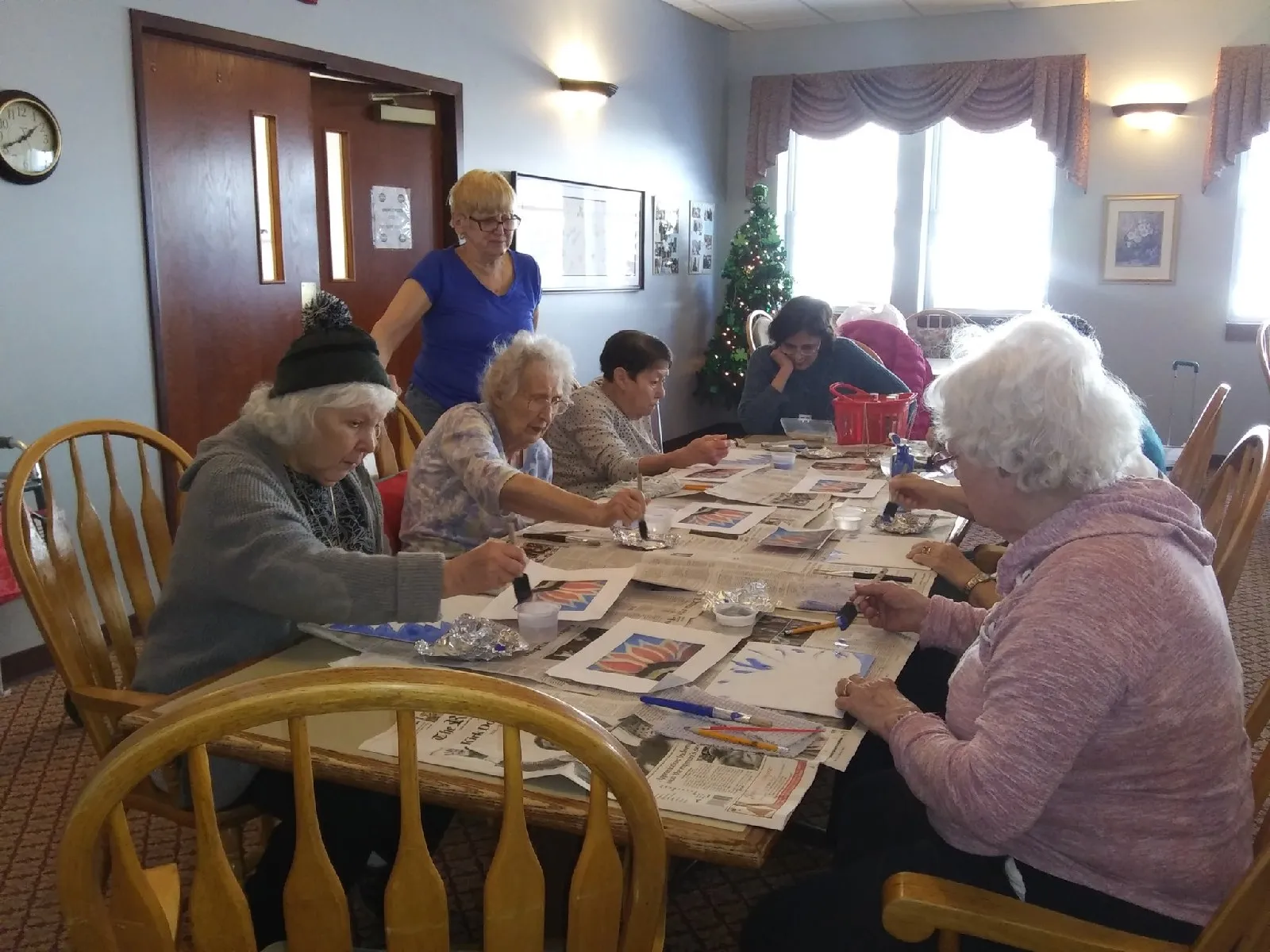 Residents engaged in an art activity at a common area
