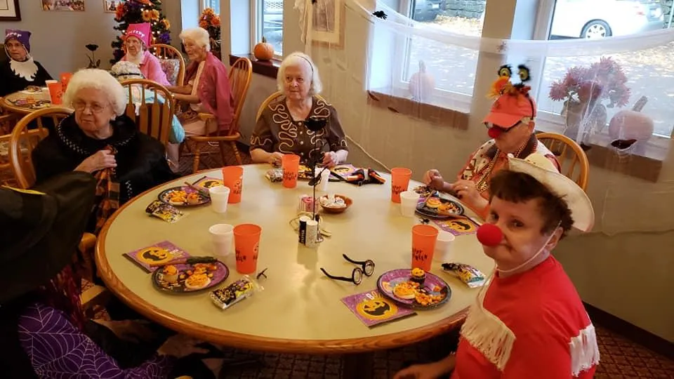 Residents enjoying a Halloween celebration with themed snacks