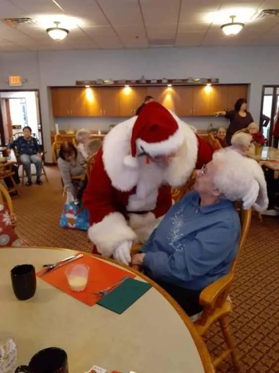 Santa visiting residents in a common area