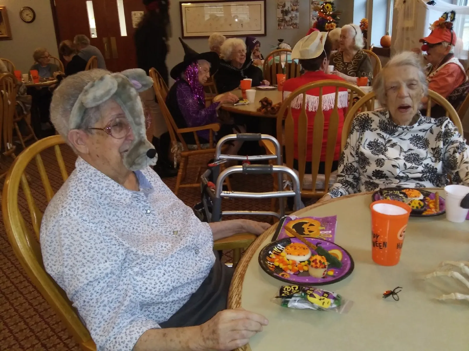Residents enjoying a Halloween-themed activity in the dining room