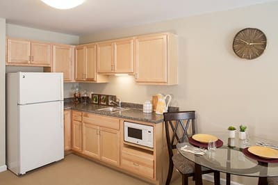 Cozy kitchenette area in a senior living apartment