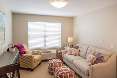 Cozy interior living area with natural light and comfortable seating