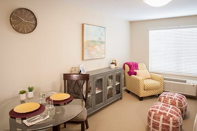 Cozy resident room with a dining area and seating