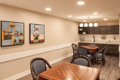 Modern common area with dining tables and artwork
