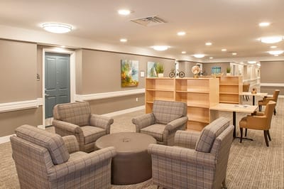 Common area with seating and decor for residents