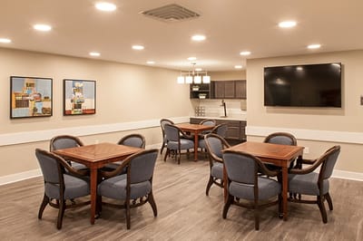 Bright common area with tables and chairs