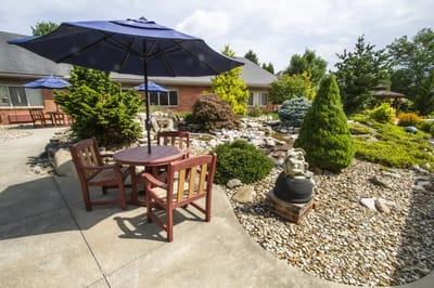 Outdoor seating area with landscaping and a fountain