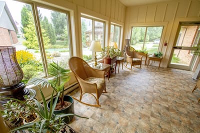 Bright and inviting sunroom with seating