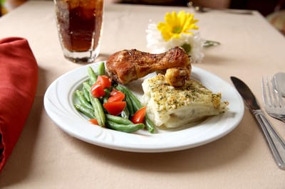 Delicious plated meal with vegetables and a drink