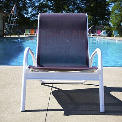 Lounge chair by the poolside at an assisted living facility