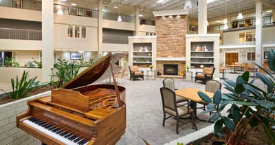 Interior common area with seating and a piano