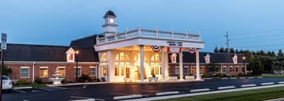 Exterior view of an assisted living facility at dusk