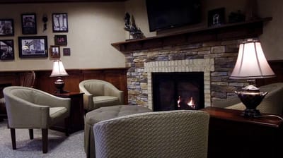Cozy lounge area with a fireplace and seating