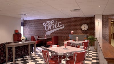 Dining area with checked floor and retro decor