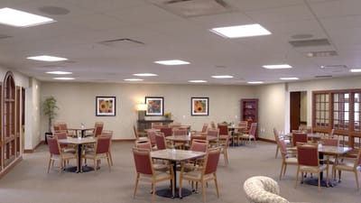 Bright dining area with tables and chairs