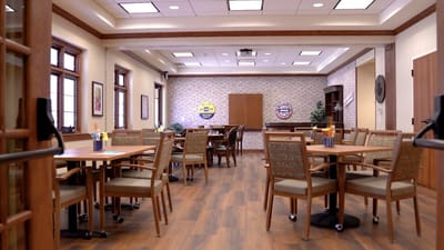 Interior view of a dining area with tables and chairs