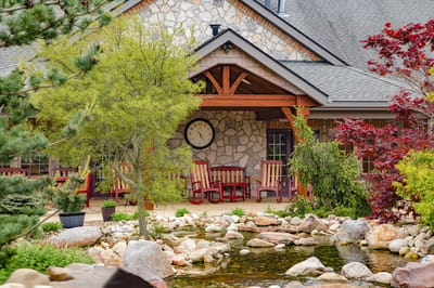 Exterior view of a welcoming entrance with seating area