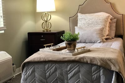 Cozy resident room with bed and decor