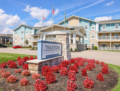 Exterior view of Traditions of Deerfield with colorful flowers