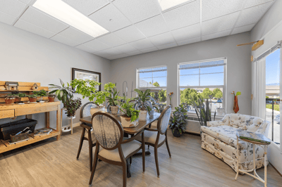 Bright common area with plants and seating