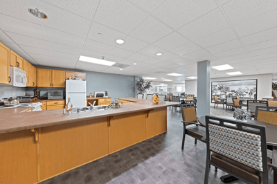 Interior view of a dining area with kitchen