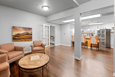 Common area featuring seating and an open kitchen