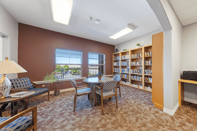 Cozy common area with bookshelves and seating