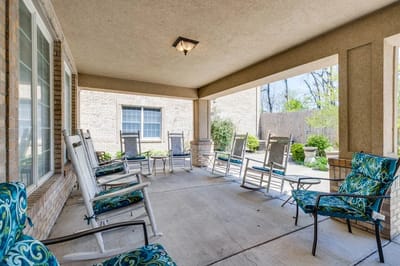A cozy outdoor seating area with rocking chairs