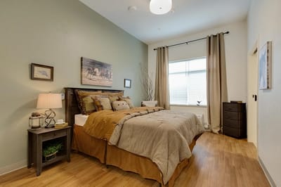 Residential room featuring cozy bedding and decor.