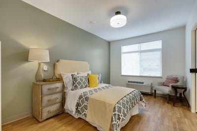Cozy resident room with a bed and furnishings