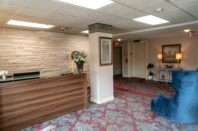 Reception area of a senior living facility with floral decor