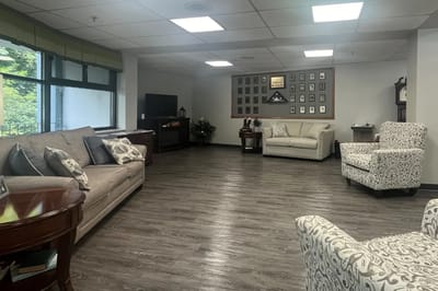A bright common area with seating and decor