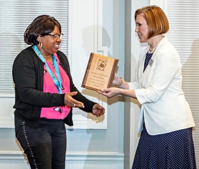 Staff receiving an award at a ceremony