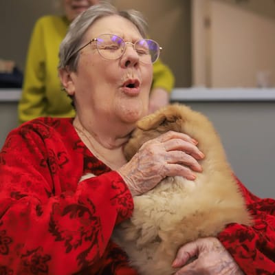 Resident enjoying time with a pet rabbit