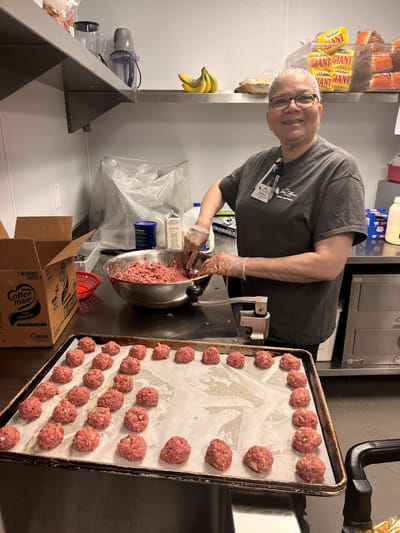 Staff member preparing food in the kitchen