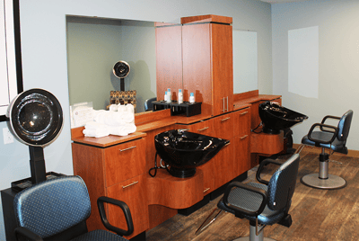 Interior of a salon area with styling chairs and sinks